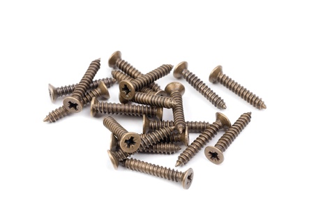 Brass screws isolation on a white  backgroundの写真素材