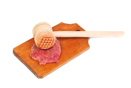 a wooden hammer for beating the meat and meatの写真素材