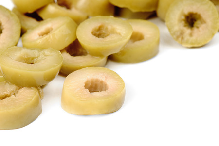 sliced green olives  isolated on the white backgroundの写真素材