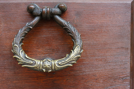 old door ring measurement on an old brown wooden door