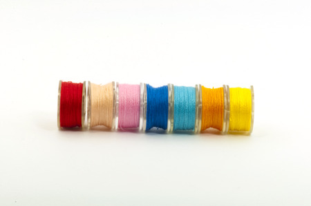 A set of Colorful bobbins with threads