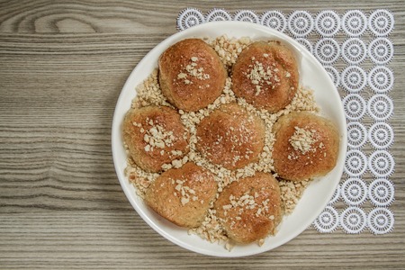 Homemade cookies in a plate on a wooden table backgroundの写真素材