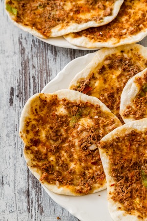 Lahmacun, home made traditional turkish pizza on wooden white backgroundの写真素材