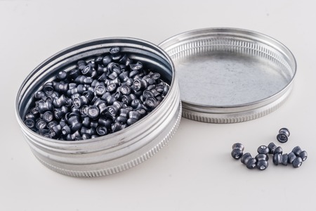 Box of airgun pellets on plain white backgroundの写真素材
