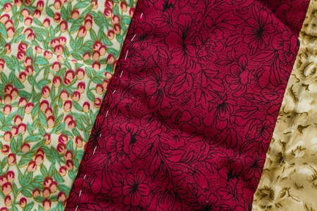 Close up from colorful patchwork sheet as texture and background