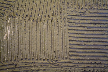 Gray plaster work, texture or background with lines