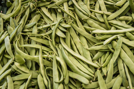 Pile of harvested fresh green beans at farm market, texture or backgroundの写真素材
