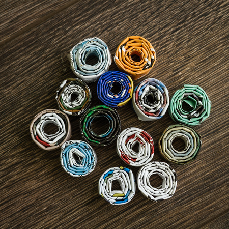 Diy project from waste magazine. Rolled old papers combine bowls.の写真素材