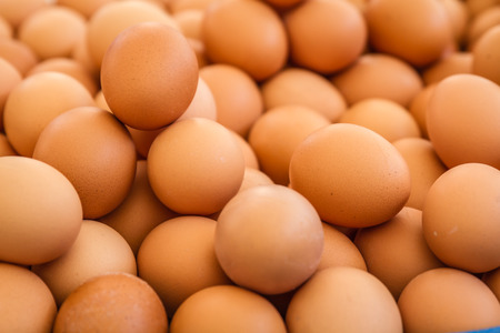 Heap of natural healthy brown eggs at the marketの写真素材