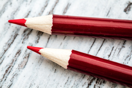 Sharpened red pencils with red body on white backgroundの写真素材