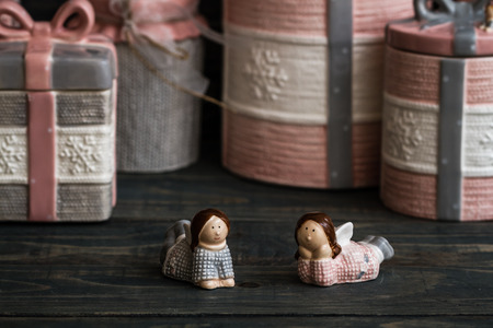 Ceramic salt and pepper shaker angel trinkets on wooden backgroundの写真素材