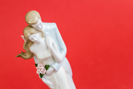 Wedding couple figurine on red backgroundの写真素材