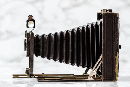 ESKISEHIR , TURKEY - AUGUST 28, 2018:  Vintage folding camera on marble backgroundのeditorial素材