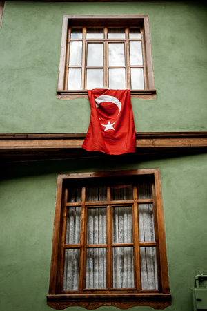 Windows of a traditional Turkish house with Turkish flagのeditorial素材