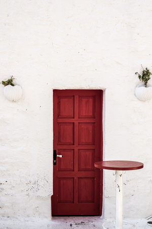 Traditional red wooden door in Bodrum, Turkeyの写真素材