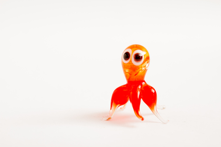 ESKISEHIR, TURKEY - DEC 1, 2016: Cute glass crystal baby octopus figurine on white backgroundのeditorial素材