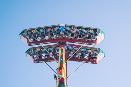 ESKISEHIR, TURKEY - NOV 20, 2010: Machines in an amusement park under clear blue skyのeditorial素材