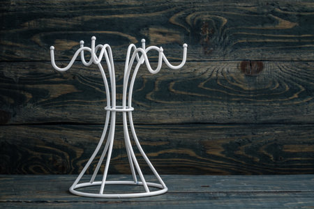 Empty white mug hanger against a blue wooden background with copy space.の写真素材