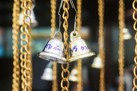 Gold chain bell ring Belief in Buddhismの写真素材