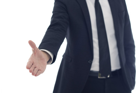 Portrait of businessman stretching out his hand ready for handshakeの写真素材