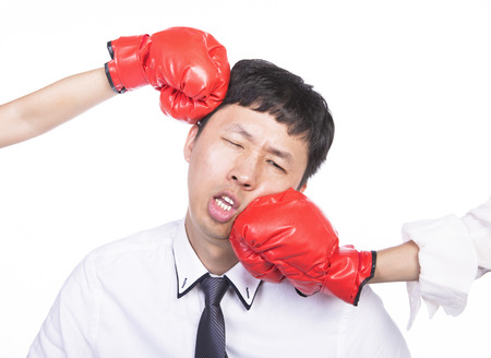 asian office worker with red boxing gloves, isolated white backgroundの写真素材
