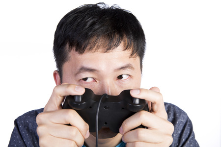 asian man taking a quick glance to his right, white background