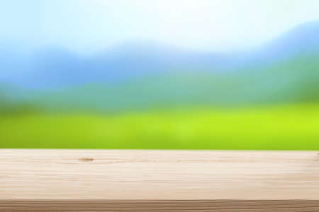 3d light wooden table top on blur mountain background. For montage product displayのイラスト素材