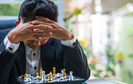 Stress businessman playing chess. strategy, management or leadership conceptの写真素材