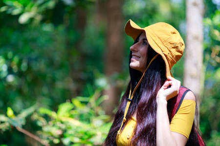 A Caucasian woman walking alone in the National park. Hiking and advanture concept.の写真素材