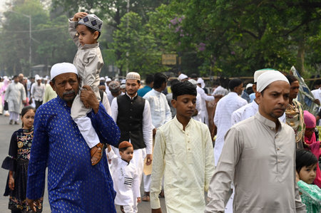 KOLKATA, INDIA - APRIL 11:  Muslim devotees arrive to offer Eid-Ul-Fitr prayers (namaz) at Red road ...
