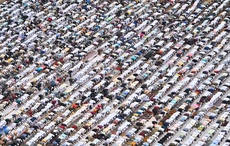 MUMBAI, INDIA - APRIL 11:  Muslim offer their namaaz on ocassion of Eid Ul Fitr at YMCA Ground,...