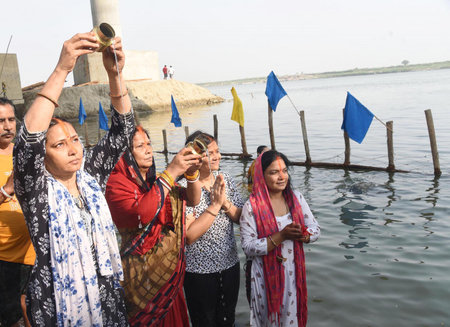 PATNA, INDIA - APRIL 12: Chhath devotees perform rituals at the bank of Ganga river at Gandhi Ghat...