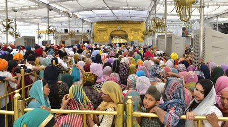 AMRITSAR, INDIA - APRIL 13:  Devotees paying obeisance on the occasion of the Baisakhi festival at the Golden Temple on April 13, 2024 in Amritsar, India. Baisakhi or Vaisakhi, a popular spring festival that marks the first day of the month of Vaisakh, isのeditorial素材