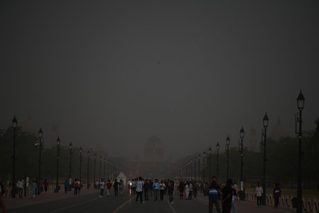NEW DELHI, INDIA - APRIL 13: People caught in a dust storm at Kartavya Path, on April 13, 2024 in New Delhi, India. IMD said that due to the influence of several weather systems, including an intense western disturbance as a cyclonic circulation lies overのeditorial素材
