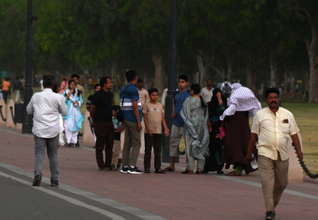 NEW DELHI, INDIA - APRIL 13: People caught in a dust storm at Kartavya Path, on April 13, 2024 in...