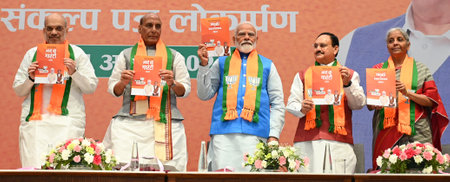 NEW DELHI, INDIA - APRIL 14: Prime Minister Narendra Modi with Union Defence Minister Rajnath Singh and Home Minister Amit Shah, BJP National president JP Nadda, Minister of Finance Nirmala Sitharaman during the launch of BJP's Sankalp Patra for Lok Sabhaのeditorial素材