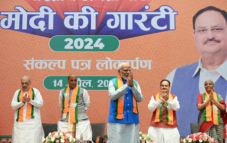 NEW DELHI, INDIA - APRIL 14: Prime Minister Narendra Modi with Union Defence Minister Rajnath Singh and Home Minister Amit Shah, BJP National president JP Nadda, Minister of Finance Nirmala Sitharaman during the launch of BJP's Sankalp Patra for Lok Sabhaのeditorial素材