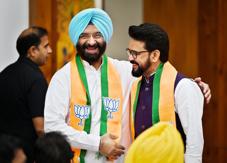 NEW DELHI, INDIA - APRIL 14: Information Broadcasting Minister Anurag Thakur with Manjinder Singh Sirsa during the launch of BJP's Sankalp Patra for Lok Sabha Elections 2024 at BJP HQ, on April 14, 2024 in New Delhi, India. BJP election manifesto - â'Saのeditorial素材
