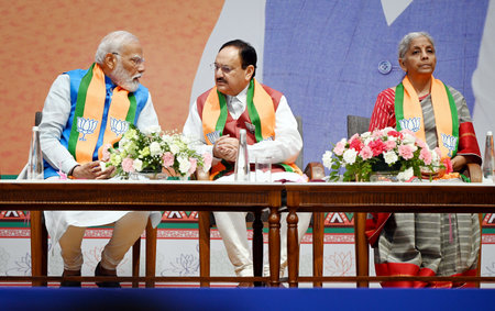 NEW DELHI, INDIA - APRIL 14: Prime Minister Narendra Modi, BJP President JP Nadda and Finance Minister Nirmala Sitharaman during the launch of BJP's Sankalp Patra for Lok Sabha Elections 2024 at BJP HQ, on April 14, 2024 in New Delhi, India. BJP election のeditorial素材