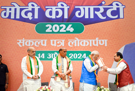 NEW DELHI, INDIA - APRIL 14: Prime Minister Narendra Modi, Home Minister Amit Shah, Defence Minister Rajnath Singh, BJP President JP Nadda during the launch of BJP's Sankalp Patra for Lok Sabha Elections 2024 at BJP HQ, on April 14, 2024 in New Delhi, Indのeditorial素材