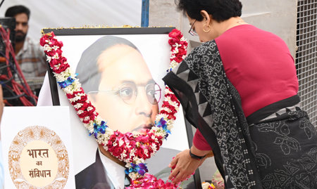 NEW DELHI, INDIA - APRIL 14: AAP Leader Atishi paying flower to Bhimrao Ramji Ambedkar Portrait during AAP's âSamvidhan Bachao - Tanashahi Hatao Diwasâ on the birth anniversary of B R Ambedkar and slammed the BJP-led Centre over party supremo Arvind Kのeditorial素材