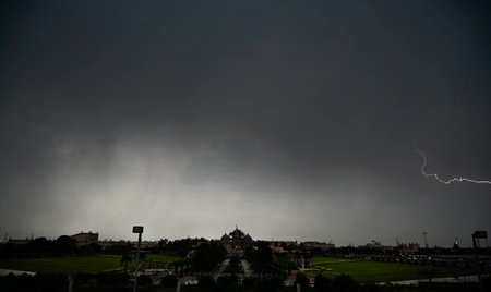 NEW DELHI, INDIA - APRIL 13: lightning seen over Akshardham Temple on April 13, 2024in New Delhi,...