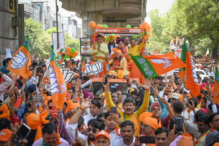 NEW DELHI, INDIA - MAY 2: Kamaljeet Sehrawat,  BJP Candidate from West Delhi Lok Sabha Constituency  seen along Virendra Sachdeva, President of Delhi BJP and Union Minister Hardeep Puri as she conducts a roadshow before filing her nomination at Vikas Puriのeditorial素材