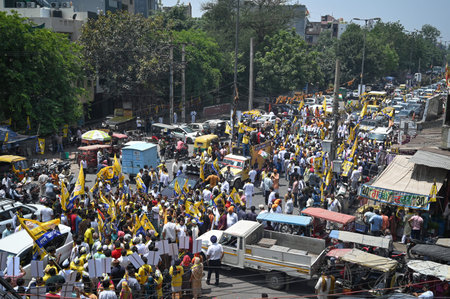 NEW DELHI, INDIA - MAY 4: Mahabal Mishra, AAP's Candidate from West Delhi Constituency for upcoming Loksabha Elections seen along AAP leaders Sanjay Singh and Kailash Gehlot during a Roadshow before filing the Nomination Papers for the Elections at Raghubのeditorial素材
