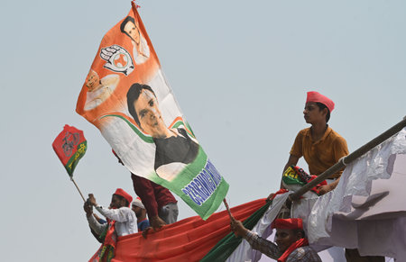 KANNAUJ, INDIA - MAY 10: Supporters climb upon the tent at the rally ground in Kannauj where Rahul...