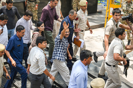 NEW DELHI, INDIA - MAY 11:  Delhi Chief Minister Arvind Kejriwal with his Wife Sunita Kejriwal gestures as he leaves following a visit to Hanuman temple on May 11, 2024 in New Delhi, India. Arvind Kejriwal got interim bail from the Supreme Court until Junのeditorial素材