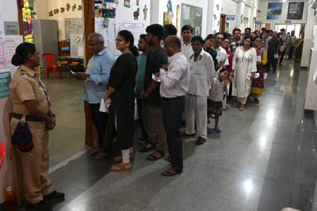 NAVI MUMBAI, INDIA - MAY 13: People in queue caste their vote for the Lok Sabha Elections 2024 at...