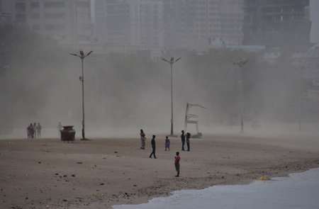 MUMBAI, INDIA - MAY 13: Gusty winds blow during a Dust strom at Girgoan Chowpatty on May 13, 2024 in Mumbai, India. Heavy winds, lightning, and rain lashed Mumbai and nearby regions of Thane and Palghar. The most affected areas include Thane, Palghar, andのeditorial素材