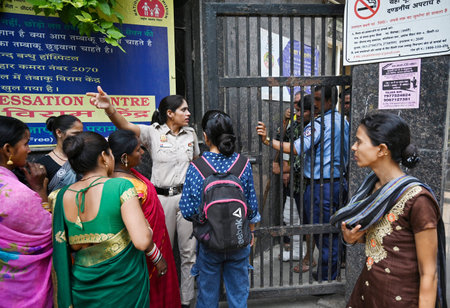NEW DELHI, INDIA - MAY 14: Patient seen gathered outside the Deep Chand Bandhu Hospital as the Bomb Squad from Delhi Police carries out search operation reportedly after a bomb threat was received in the early hours of morning at Ashok Vihar on May 14, 20のeditorial素材