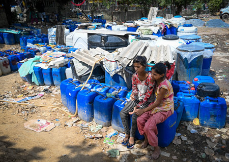 NEW DELHI, INDIA - JUNE 6: People fill water from a Delhi Jal Board Tanker amid water scarcity at...